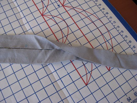 waistbank edges pressed to center and quarter fold